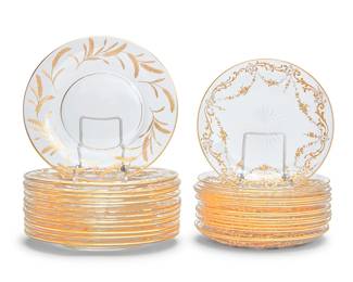1175
Two sets of gilt-heightened glass dessert plates
Late 19th/early 20th century
Comprising a set of 12 plates with sheaves of wheat (8" Dia.), and a set of 17 plates with gilt vinery and swag decoration (7" Dia.)
29 pieces
Estimate: $200 - $300