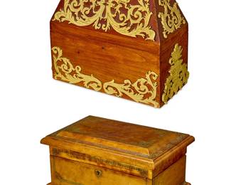 1282
Two Continental hinged table boxes
20th century
Comprising a Spanish carved faux ivory-mounted wood hinged box with a tall peaked lid, and an Italian gilt-decorated leather-clad hinged locking jewelry box with stylized ogee bracket feet
2 pieces
Spanish: 11" H x 11.5" W x 6" D; Italian: 6.5" H x 12" W x 8" D
Estimate: $200 - $300
