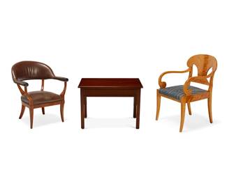 1156
Two Continental armchairs and a side table
20th/21st century
Comprising a fruitwood card or club chair, with brown leather upholstery and brass tacking, a Biedermeier-style maple open armchair with blue and cream upholstered seat, and a mahogany side table with a single drawer
3 pieces
Club: 32" H x 26.5" W x 24" D; Biedermeier: 36" H x 24" W x 23" D; Table: 23" H x 31" W x 19" D
Estimate: $200 - $300