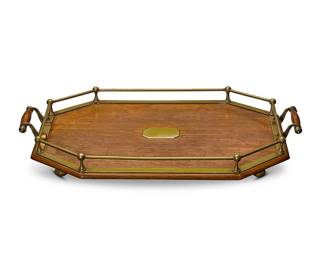 1284
A silver plate-mounted oak tray
19th century
The octagonal galleried with opposed handles and bun feet
3" H x 23.5" W x 14.5" D
Estimate: $100 - $200