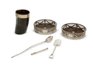 1347
A group of sterling silver and silver-mounted table items
Each marked for sterling; three marked for Tiffany & Co.; antler marked for Asprey
Comprising a pair of English pierced silver and wood coasters (1.25" H x 4.75" Dia.), an Asprey silver-mounted carved antler cup (4.125" H), two Tiffany & Co. sterling silver spoons (Longer: 8.25"L), and a Tiffany & Co. cocktail swizzle (stored: 3"L)
6 pieces
Weighable sterling: 1.3 oz. troy approximately
Estimate: $300 - $400