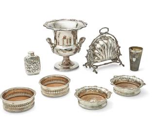 1340
A group of silver-plated and silver plate-mounted table items
20th century
Bun warmer with mark of Walker & Hall, Sheffield
Comprising an English silver-plated shell-form bun warmer, a large glass jar with an Argentinian silver-plated lid (personalized), a group of silver plate, metal, and wood bar accessories including five pairs of wine coasters and three single, an ice bucket, two cocktail shakers, and a flask, a silver plate-mounted horn cup (personalized), and other items
31 pieces
Glass jar: 12.5" H x 6.5" Dia.; Horn cup: 5.5" H x 3.25" Dia.
Estimate: $200 - $300