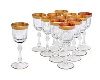 1061
A set of twelve Bohemian gilt-heightened clear and frosted claret glasses
Early 21st century
Each with gilt bands around the rim and foot, the stem centered by a frosted orb
12 pieces
Each: 8" H
Estimate: $100 - $200