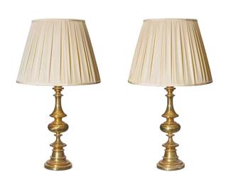 1292
A pair of turned brass table lamps
Late 20th century
Each single-light lamp surmounted by a pleated fabric shade, electrified
2 pieces
Each overall: 32" H x 18" Dia.
Estimate: $100 - $200