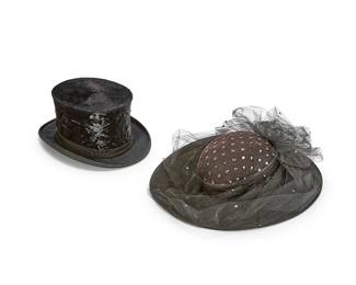 1181
Two formal evening hats
Each with label for maker
Comprising a Herbert Johnson gentlemen's beaver fur felt black top hat with grosgrain ribbon and brim, as well as a ladies' black Whittall & Shon Doeskin wool felt hat with sequin-embellished net tulle crown and ruched accents, each housed in a black rigid plastic storage case
2 pieces
Top hat: Size: 57; 5.25" H x 9.75" W x 12.25" D; 22" inner C approximately
Ladies' hat: 4" H x 14.5" W x 16.5" D; 21" inner C approximately
Estimate: $200 - $300