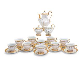 1102
A Meissen porcelain tea service
Mid/late 20th century
Underglaze blue crossed swords with double cancellation; various impressed numerals
With lobed gilt decoration on white ground, comprising a teapot, a covered sugar, a cream jug, and ten tea cups with ten saucers
23 pieces
Teapot: 7.25" H; Covered sugar: 3.75" H
Estimate: $200 - $300