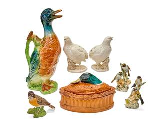 1123
A group of Continental porcelain bird figural table items
20th century
Each variously marked for maker
Comprising a French St. Clement majolica mallard-form pitcher (12.5" H), a French Pillivuyt pâté terrine with a mallard-form cover (6" W x 8.25" D), a pair of Italian white glazed figures of quail (6" H), a pair of Capodimonte figural groups of birds (taller: 4.75" H), and a Boehm figure of a robin (4" H)
7 pieces
Estimate: $200 - $300