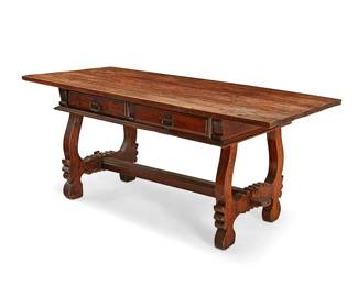 1220
A Baroque-style carved hardwood library table
20th century
The table with two drawers and wrought-iron pulls, each drawer interior with later moiré lining, raised on lyre-form legs joined by a heavy pegged stretcher
33" H x 77" W x 35" D
Estimate: $400 - $600