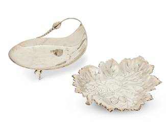 1357
Two sterling silver leaf-form dishes
Mid-20th century
Blossom marked: Esterling / 925 / JP; American marked: Sterling -W-
Comprising a dish in the style of Georg Jensen's 'Blossom' pattern, and an American strawberry leaf-form dish with three ball feet
2 pieces
Blossom: 4.25" H x 10.75" W x 7.75" D; American: 1.75" H x 10.75" W x 8.75" D
24.4 oz. troy approximately
Estimate: $400 - $600