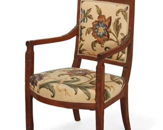 1229
A French carved walnut fauteuil
19th century
The chair carved with foliate motifs to crest rail, armrests, and leg fronts, upholstered in a floral pattern fabric
35" H x 22" W x 18" D
Estimate: $200 - $300