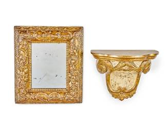 1130
An Italian Baroque carved giltwood mirror
The mirror 17th/18th century, the bracket 20th/21st century
The mirror with carved scrolled foliate motifs, together with a Baroque-style gilt and cream-painted wall bracket
2 pieces
Mirror: 21" H x 17.5" W; Bracket: 16.5" H x 18.25" W x 9" D
Estimate: $500 - $700