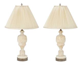1184
A pair of Italian carved alabaster table lamps
Early/mid-20th century
Each single-light lamp set on a round pierced metal base and surmounted by a pleated fabric shade, electrified
2 pieces
Lamp without shade or harp: 17.25" H x 4.5" Dia.; Each shade: 9" H x 14.25" Dia.
Estimate: $300 - $500