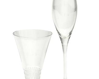 1103
Two sets of Contemporary glassware
Late 20th/early 21st century
Six etched: Lalique ® France [post-1978]; five etched: Cartier
Comprising a set of six Lalique clear and frosted glass flared footed 'Bourgueil' liqueur glasses, and a set of five Cartier Champagne flutes
11 pieces
Each Lalique: 5" H x 3.5" Dia.; Each Cartier: 8.75" H
Estimate: $250 - $350