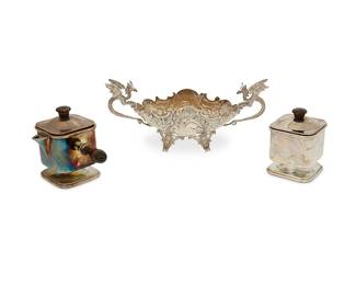 1012
A group of sterling silver table items
20th century
Each marked for sterling, the set further marked: A
Comprising a creamer and sugar set with wood finials and handles, and a two-handled footed oval bowl with dragon-form handles
3 pieces
Larger of set: 3.75" H x 4.5" W x 3.25" D; Bowl: 4" H x 9.375" W x 3.25" D
Total weight: 18.2 gross oz. troy approximately
Estimate: $250 - $350