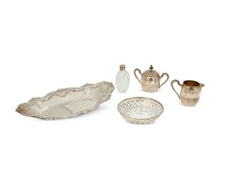 1359
A group of Gorham sterling silver table items
20th century
Each marked for Gorham and for sterling; perfume numbered: D642; serving dish numbered: 730; creamer and sugar numbered: 2885; pierced numbered: A6945
Comprising a pierced footed dish with a glass liner (1.5" H x 5" Dia.), a silver-mounted cut glass perfume bottle (4" H x 2.75" W x 1.5" D), an oblong serving dish (1.75" H x 12.5" W x 8" D), a creamer (2.75" H x 4.25" W x 2.5" D), and a covered sugar (4" H x 5.5" W x 3" D), personalized
5 pieces
Total weighable sterling: 21.88 oz. troy approximately
Estimate: $400 - $600