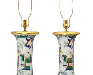 1189
A pair of Chinese porcelain table lamps
20th century
Each single-light lamp with giltwood base and cover, depicting Chinese figures at various pursuits, electrified
2 pieces
Each without harp: 22" H x 9" Dia.
Estimate: $200 - $300