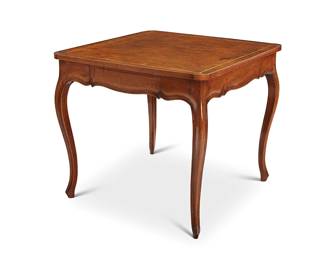 1051
A Louis XV-style fruitwood games table
Late 19th/early 20th century
The square form top inset with a brown leather top with gilt-stamped border above two opposing drawers, raised on slender cabriole legs
29" H x 32.5" W x 32.5" D
Estimate: $300 - $500