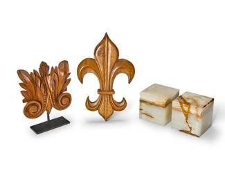 1256
A group of decorative accents
20th century
Comprising a carved walnut fleur-de-lis, a carved wood architectural element mounted on a metal stand, and a pair of onyx cube bookends
4 pieces
Fleur: 12" H x 8" W x 1" D; Architectural overall: 9" H x 7" W x 2.25" D; Each bookend: 4.125" cubed
Estimate: $100 - $200