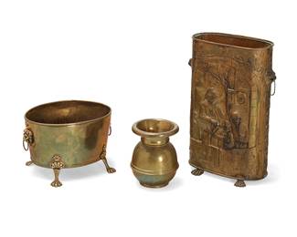 1117
A Victorian brass umbrella stand and firewood bin
Mid-19th/20th century
Comprising a repoussé hammered brass umbrella stand with figures in relief and a copper liner, and an oval firewood bin with lion masks, ring handles, and paw feet, together with a brass spittoon
3 pieces
Umbrella stand: 26" H x 16" W x 8" D; Bin: 11.75" H x 18" W x 13" D; Spittoon: 11.5" H x 9" Dia.
Estimate: $300 - $500