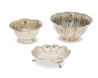 1011
Three American sterling silver scalloped bowls/dishes
Early/mid-20th century
One marked for Tuttle and numbered: 2670; another marked: Old New England Craftsmen, Inc. / A31; last marked: Watson Company / A7
Comprising a Tuttle sterling silver 'Dublin 1720' scalloped bowl (4" H x 7.75" Dia.), an Old New England Craftsmen sterling silver scalloped bowl (3" H x 6" Dia.), and a Watson sterling silver 'Exemplar' scalloped footed dish (1.5" H x 6" W x 4.75" D)
3 pieces
Total weight: 27 oz. troy approximately
Estimate: $500 - $700