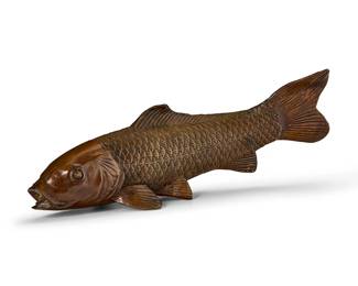 1122
A bronzed model of a carp
20th century
Marked on the gills: L.M. Morise
The bronzed composite figure of a fish
6.625" H x 19" W x 8" D
Estimate: $150 - $250