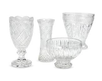 1144
Four Waterford cut glass vessels
Late 20th/early 21st century
Each marked for Waterford; one additionally marked: Marquis; another numbered, signed, and dated: 1/1 / Jim O'Leary / 97
Comprising an hourglass-form vase, a tulip-form footed vase with a round foot, a large flared and footed wine cooler, and a footed bowl
4 pieces
Tallest: 13" H x 6.375" Dia.; Shortest: 7" H x 9.875" Dia.
Estimate: $700 - $900