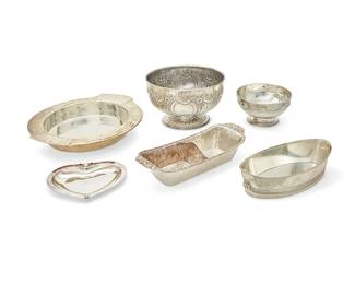 1004
A group silver-plated bowls and dishes
20th century
One footed bowl with mark of William Spurrier, Ltd., Birmingham and London; one centerpiece bowl with mark of Walker & Hall, Sheffield; wheat decorated bowl marked: M.M. Evolucao / Made in Brazil; jardienière marked: TCPLD
Comprising a two-handled footed bowl with bow, swag, and fluted decoration (6" H x 11.5" W x 9.5" D), a footed bowl with swag and fluted decoration (5.5" H x 10" Dia.), a footed centerpiece bowl (6" H x 9.5" Dia.), a Sheffield footed punch bowl (9" H x 14.5" Dia.), a large shallow bowl decorated with sheaves of wheat (3.25" H x 22" W x 20.5" D), a rectangular divided serving dish with chased decoration (4" H x 19" W x 7.5" D), an oval jardinière with garland decoration and lion's head ring handles (4" H x 16" W x 7.5" D), and a faux jewel-mounted cordiform dish (1" H x 11.5" W x 9.5" D)
8 pieces
Estimate: $150 - $250