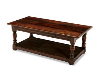 1275
A Jacobean style oak coffee table
20th century
The rectangular top over an apron with single drawer raised on turned wood legs joined by a platform stretcher
18" H x 48" W x 24" D
Estimate: $100 - $200
