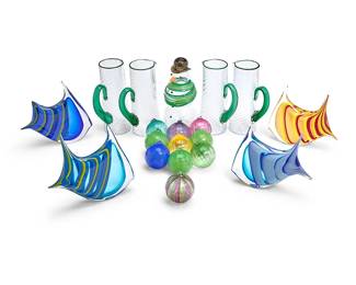 1332
A group of Martha's Vineyard Glassworks art glass items
Early 21st century
Snowman and pitchers each dated and etched: Martha's Vineyard Glassworks; fish signed variously for Robert Phillips, dated, and: MV; ornaments unmarked
Comprising a figure of a snowman (11.5" H x 5.5" Dia.), four Robert Phillips (b. 20th century) glass angel fish figures (Each: 9" H x 10" W approx.), four clear glass pitchers with a green wrapped lip and handle, each body with a twist design (10.5" H x 8" W x 4" D), and ten associated multicolored blown glass Christmas tree balls (3.5" Dia.)
19 pieces
Estimate: $200 - $300