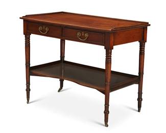 1131
An English mahogany server
19th century
With a rectangular galleried top over an apron fitted with two locking drawers, each interior with later moiré lining, raised on turned wood legs joined by a shelf stretcher, on casters
29" H x 37" W x 21.5" D
Estimate: $400 - $600