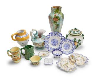 1134
A group of Continental ceramic vessels
20th/early 21st century
Most variously marked for maker
Comprising a Rörstrand gilt and blue-glazed majolica bed chamber pitcher, a polychrome-glazed pottery six-sided vase decorated with flowers, and eleven other pieces of European pottery and ceramics, including pitchers, covered jars, bowls, dishes, a carafe, and various plates
13 pieces
Pitcher: 15" H x 9" W x 9.25" D; Vase: 14" H x 6" W
Estimate: $300 - $500