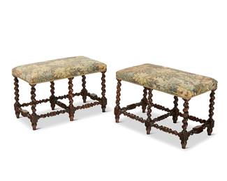 1035
A pair of William & Mary-style upholstered wood benches
20th century
With tapestry-style upholstery, passementerie trim, and barley twist legs and stretchers
2 pieces
19" H x 29" W x 15.5" D
Estimate: $400 - $600