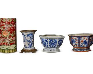 1119
Four Chinese porcelain vessels
20th century
The vase and stand each bearing apocryphal reign mark to underside
Comprising two porcelain octagonal jardinières, a gilt-metal-mounted vase, and a red ground stick stand
4 pieces
Stand: 18.5" H x 9.125" Dia.; Smaller jardinière: 8.5" H x 14.5" Dia.
Estimate: $300 - $500