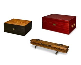 1329
A Hart & Hertel iron and wood cigar press and two humidors
19th/20th century
Larger humidor marked: Nat Sherman
Comprising a German iron-mounted cigar press, a Nat Sherman humidor, and another smaller humidor
3 pieces
Cigar press: 4.5" H x 22" W x 5.5" D; Nat Sherman humidor: 8" H x 18" W x 11" Dc
Estimate: $300 - $500