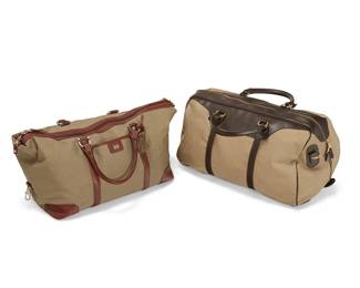 1121
Two canvas and leather duffle bags
Late 20th century
Each with label for maker
Comprising a Cutter & Buck duffle with tan leather trim and handles, and a Mulholland duffle with dark brown leather trim and handles
2 pieces
Larger: 12" H x 19.25" W x 14" D ; Smaller: 11" H x 19" W x 10" D
Estimate: $100 - $150