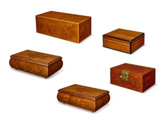 1248
Five wood cigar humidors
20th century
One marked to interior: Dunhill
Comprising two with marquetry inlay depicting foliate motifs, and three with hinged lid, one with fitted interior and humidity gauge
5 pieces
Largest: 6.25" H x 16" W x 8" D; Smallest: 14.125" H x 10" W x 8.75" D
Estimate: $200 - $300