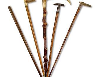 1190
A group of walking sticks
20th century
Comprising three with carved antler handles, one with a hammer head handle, and another without a handle
5 pieces
Longest: 36.5" L
Estimate: $200 - $300