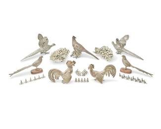 1020
A group of silver-plated figural table ornaments
20th century
Pheasants with mark of Smythson; rabbit place card holders marked: Portugal; silvered birds marked to underside: Made in India
Comprising figures of a rooster and a hen, 3 figures of pheasants, 3 Italian grape clusters, and four sets of figural place card holders including 5 pineapples, 6 rabbits, 12 pheasants, and 8 elephant figures, together with two silvered bird figures on wood stands
41 pieces
The rooster: 7.5" H x 9" W; Largest cluster: 5.5" H x 12" W x 7" D; Pheasants: 9" H x 15" W; Pair silvered metal: 6" H x 12" W x 3" D
Estimate: $250 - $350