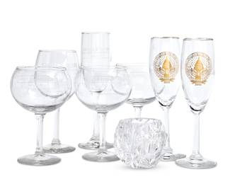 1054
A group of U.S. Presidential Inauguration commemorative glassware
Early 21st century
One with Tiffany factory etched mark: each inscribed: George Bush; most further inscribed
Comprising three Champagne glasses, four wine glasses, and one Tiffany & Co. votive candle holder
8 pieces
Tallest: 8" H
Estimate: $100 - $150