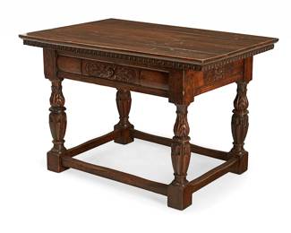 1077
An Italian walnut library table
18th/19th century with later alterations
The single-drawer table with egg and dart trim, raised on leaf-carved and turned legs joined by stout stretchers
32" H x 48" W x 32" D
Estimate: $700 - $900