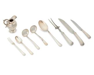 1018
A group of Dutch silver service items
20th century
Each with Dutch hallmarks; six pieces date marked for 1976 and marked for maker: VKB
Comprising a set of 18 Dutch sterling silver-handled steak knives, together with a matching carving fork and knife (Largest: 11.75" L), a group of 6 pieces of sterling silver flatware (Largest: 10" L), and a silver footed creamer with a Greek key border (4.75" H x 4" W x 2.75" D)
27 pieces
Total weight: 17 oz. troy approximately
Estimate: $500 - $700
