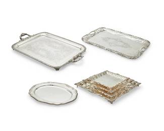 1006
A large group of silver-plated serving trays and dishes
Late 19th/20th century
Each variously marked
Comprising a group of 3 large silver-plated two-handled rectangular footed serving trays, 5 Sheffield plate and silver-plated serving dishes and trays, each with a gadrooned edge, a set of 4 silver-plated graduated square footed serving trays, 1 large silver-plated rectangular serving tray with two inset handles, and a group of 4 silver plate rectangular serving trays, one personalized
17 pieces
Largest: 2" H x 32" W x 20" D; Smallest of graduated: 1.5" H x 12" W x 12" D
Estimate: $500 - $700
