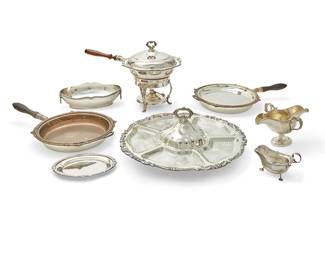 1014
A group of silver-plated serving vessels
20th century
Most variously marked for maker
Comprising 4 double-spouted sauce boats with three mismatched underplates, a pair of Walker & Hall footed sauce boats, a de Montfort sauce boat and underplate, and a group of eleven silver-plated serving pieces, including chafing dishes, entrée dishes, and others, some with bases, liners, and burners
22 pieces
Largest: 7.5" H x 19" Dia.; Walker & Hall sauce boats: 3.75" H x 6.5" W x 3.75" D
Estimate: $150 - $250