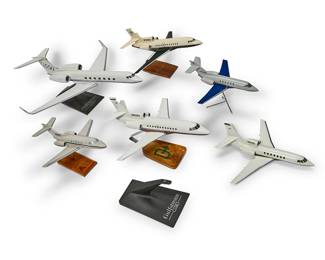 1251
A group of model planes
Late 20th/early 21st century
Most variously marked for maker; each with tail registration number
Comprising two Gulfstream models and four others, five of which are mounted to a stand, together with one extra stand
6 pieces
Largest overall: 10" H x 23" W x 25.5" D; Smallest overall: 9" H x 13" W x 13" D
Estimate: $200 - $300