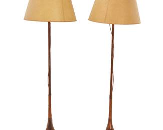 1325
A pair of brass-mounted wood floor lamps
20th century
Each single-light lamp with a tripod base, surmounted by a paper shade, electrified
2 pieces
Each: 63" H
Estimate: $100 - $200