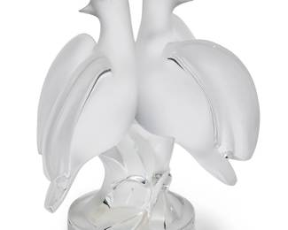 1126
A Lalique clear and frosted glass 'Ariane' dove figural group
20th century
Etched: Lalique ® France [post-1978]; with applied paper label bearing model number: 11638
Depicting two dove figures perched on an abstract base
9" H x 7" W x 5" D
Estimate: $300 - $500