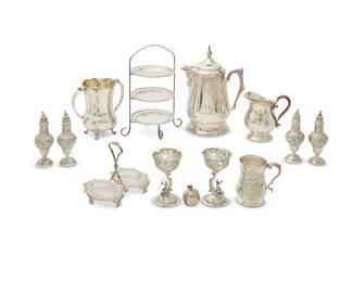 1008
A group of silver-plated table items
20th century
Most variously marked for maker
Comprising a salt and pepper shaker set, a condiment set, a two-dish sauce set, an 8-piece salt and pepper set including master salts and pepper shakers with putti decoration, two casters, a shell-form condiment dish, a tiered stand with three plates, two trivets, two oblong dishes, a group of items with cobalt blue glass liners including a footed bowl, a pair of master salts, and a mustard pot, and other items
39 pieces
Stand: 14.5" H x 11" W x 8.5" D
Estimate: $150 - $250