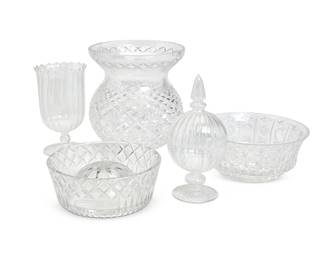 1261
A group of assorted glass table items
Late 20th/early 21st century
Some variously marked for maker; Tiffany engraved: James Conlon / 10th Anniversary LA Opera
The group including but not limited to: a Tiffany & Co. square glass dish with basket-weave border, a Waterford bulbous cut glass vase, a pair of hurricane lights with blown glass shades mounted on silver-plated bases, and assorted vases, tumblers, and other items
17 pieces
Each hurricane: 15.5" H x 5.75" Dia.; Waterford: 8.875" H x 8.375" Dia.; Tiffany: 1" H x 8" W x 8" D
Estimate: $200 - $300