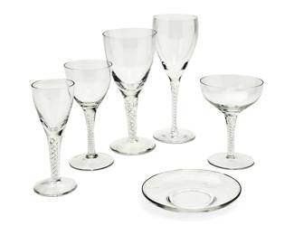 1221
A group of Steuben-style glassware
Late 20th century
Some variously etched: Stuart / Stuart England
Each with air twist stems including wine glasses of various sizes, champagne saucers, and one plate
23 pieces
Tallest wine 8.25" H; Champagne: 5.25" H; Saucer: 5.5" Dia.
Estimate: $200 - $300
