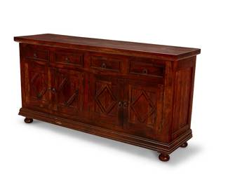 1283
A Continental Baroque-style wood credenza
Late 20th/early 21st century
With four drawers and four cupboard doors, each with iron ring pulls, above an architectural lower molding, supported by bun feet
36" H x 70" W x 20" D
Estimate: $200 - $300